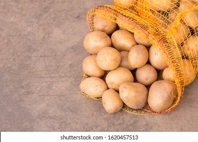 Potato Sack On A Textured Background, Empty Copy Space