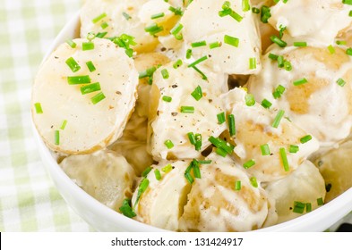 Potato salad with yoghurt and mayonnaise dressing with chives
