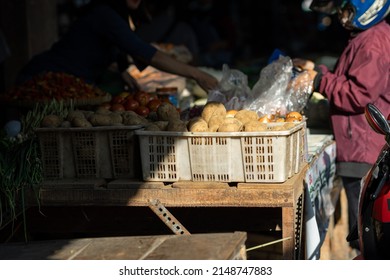 Potato seller in traditional market. - Powered by Shutterstock