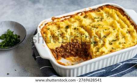 Potato shepherds pie in baking dish: pie, potato, shepherds, food, dish, meal, baking, cooking, homemade, delicious, tasty, lunch, dinner, brunch, snack, culinary, recipe, savory, flavorful, appetizing, mouthwatering, serving, servings, white, background, surface, table, kitchen, bake, baked