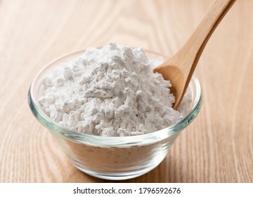 Potato Starch And A Wooden Spoon On The Table.