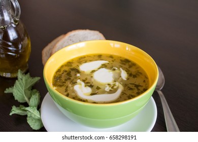 Potato And Tarragon Soup With Cream On Dark Wooden Background.