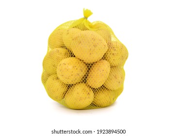Potatoes in mesh sack isolated on white background - Shutterstock ID 1923894500