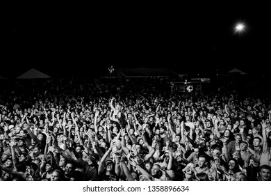 Potchefstroom, north west, South Africa 02 01 2019 festival show crowd audience in black and white with hands in the air screaming, laughing and dancing corona virus