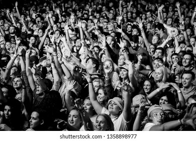 Potchefstroom, north west, South Africa 02 01 2019 festival show crowd audience in black and white with hands in the air screaming, laughing and dancing