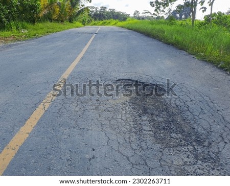 pothole asphalt road in Kalimantan, Indonesia