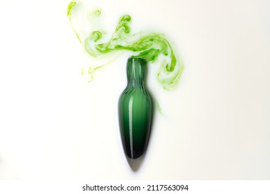 Potion In Green Glass Flask Bottle On White Background. Magic Wizardry Elixir Liquid . Witchery Ingredient For Healing And Spell. 