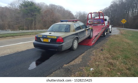 Potomac, Maryland/USA-01/13/2016: A Maryland State Police Car Being Loaded Onto Tow Truck.