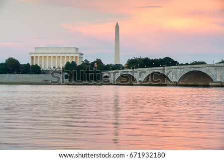 Potomac river with the Arlington Memorial bridge leading to Lincoln and Washington memorials against a beautiful sunset