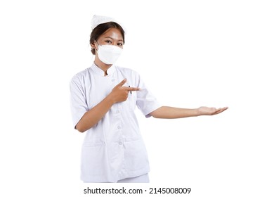 Potrait Of An Asian Nurse. She Is Wearing Mask. Isolated On White Background.