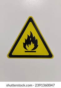 potrait mode- white safety cabinet with flammable warning sign in laboratory