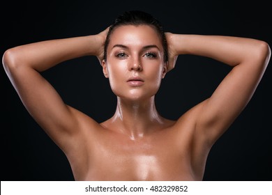 Potrait of young beautiful woman with oily and wet skin