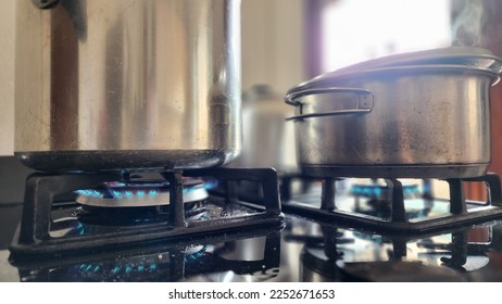 Pots cooking food on the stove. - Shutterstock ID 2252671653
