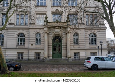 Potsdam, Germany - 12/19/2019: Building And Openwork Door Of Einstein High School. Renovated Gymnasium Building With Sports Field