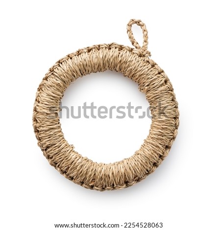 A potsherd made of straw on a white background. Craftwork. View from above.