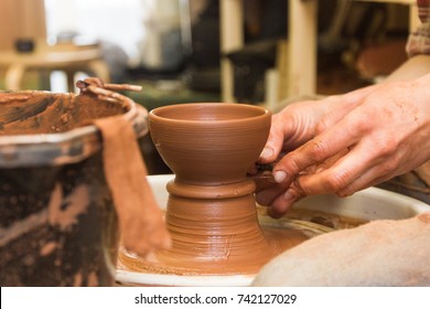 Potter doing his work