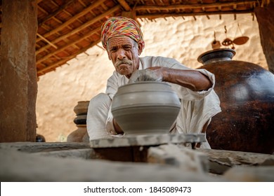 Potter at work makes ceramic dishes. India, Rajasthan. - Powered by Shutterstock