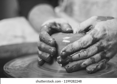 Potter At Work. Makes A Jug Out Of Clay