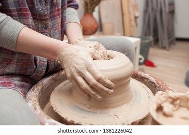 Potter Working On Potters Wheel Making Ceramic Pot From Clay In Pottery Workshop