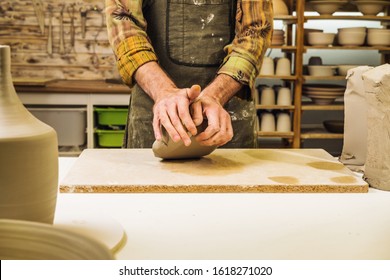 Potter In Workshop Preparing Material Clay For Ceramics. Creating Pottery Art And Handicraft. Hands Detail. No Face.