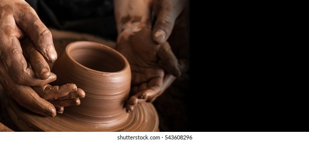 Potters And Child Hands.