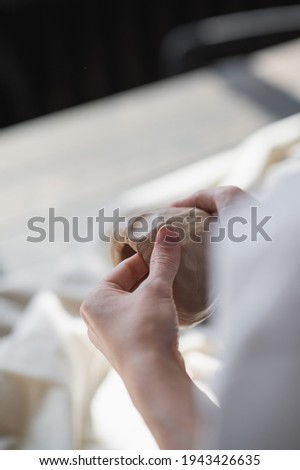 Caregiver checking blood pressure to a senior woman