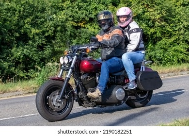 Potterspury,Northants, UK - August 14th 2022. Man And Woman On A 2015 1690 Cc HARLEY DAVIDSON Motorcycle