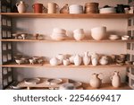 Pottery backgrounds, ceramics and shelf in studio, creative store or manufacturing startup. Clay products, collection and display in workshop, small business and retail craft shop of stock production
