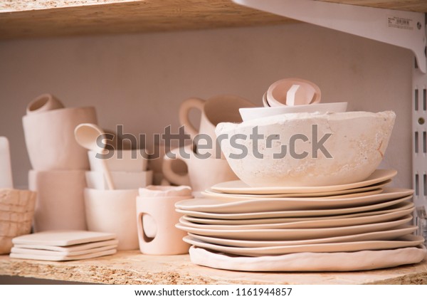 Pottery,\
ceramic dishes handmade in a pottery\
workshop