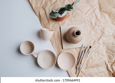 Pottery ceramic products of blank beige color. Fired and polished. Bowls, cups and vase. Top view. - Shutterstock ID 1709664991