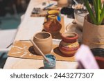 Pottery lesson master class for kids children, process of making clay pot on pottery wheel, potter hands creating ceramic crockery handcrafts, ceramist molding and painting jar or vase