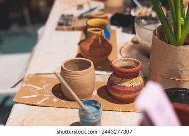 Pottery lesson master class for kids children, process of making clay pot on pottery wheel, potter hands creating ceramic crockery handcrafts, ceramist molding and painting jar or vase - Powered by Shutterstock