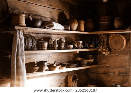 pottery stands on shelves in a wooden house, selective focus