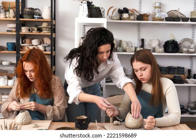 Pottery workshop class. A pottery crafts dish from a raw clay. Creating ceramics - Powered by Shutterstock