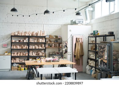 Pottery workshop with crockery, working tools and tables - Powered by Shutterstock