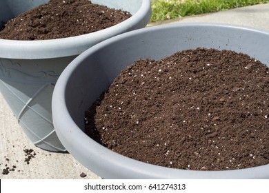 Potting Soil In Large Gray Pots
