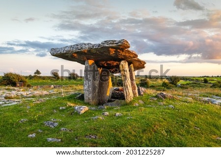 Poulnabrone dolmen, photographed here at sunset, is a portal tomb located in the Burren, County Clare, Ireland