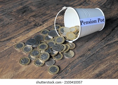 A Pound Coin In A Pile Of Cash Saved In A Pension Pot.