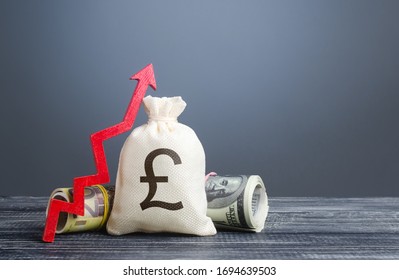 Pound Sterling Money Bag And Red Arrow Up. Influx Of Investment And Capital, Increase Of Wealth. Economic Recovery And Growth, Optimistic Forecast Of Economic Rise. Market Stability. Rising Inflation.