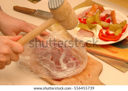 breast pounding with mallet Pc copper bottom cookware