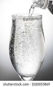 Pour Carbonated Water Into A Glass