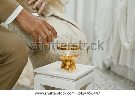 pour ceremonial water, thai culture and religion wallpaper background concept