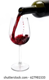 Pour An Excellent Red Vintage Wine In An Elegant Crystal Goblet, Isolated On White Background.