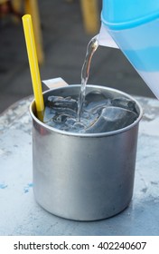 Pour into a stainless glass  - Shutterstock ID 402240607