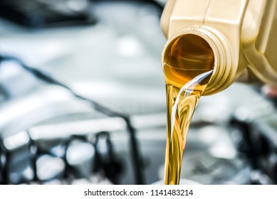 Pour Motor Oil To Car Engine. Fresh Yellow Liquid Change With Back Light. Maintenance Or Service Vehicle Concept.