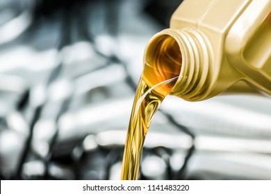 Pour Motor Oil To Car Engine. Fresh Yellow Liquid Change With Back Light. Maintenance Or Service Vehicle Concept.