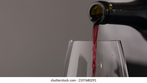 Pour Red Wine Into Wineglass , Wide Photo