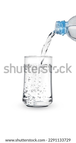 Pour water from a plastic bottle into a glass,with Clipping Path.