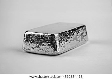 Poured cast solid silver bullion bar, shot in a white studio.