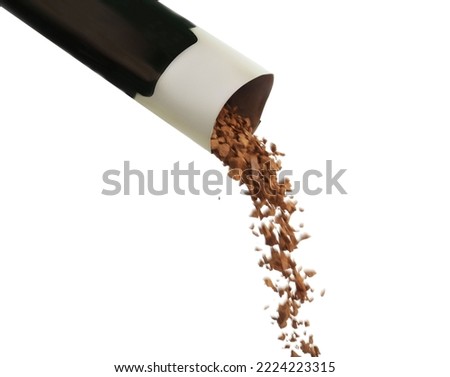 Pouring aromatic instant coffee from sachet on white background
